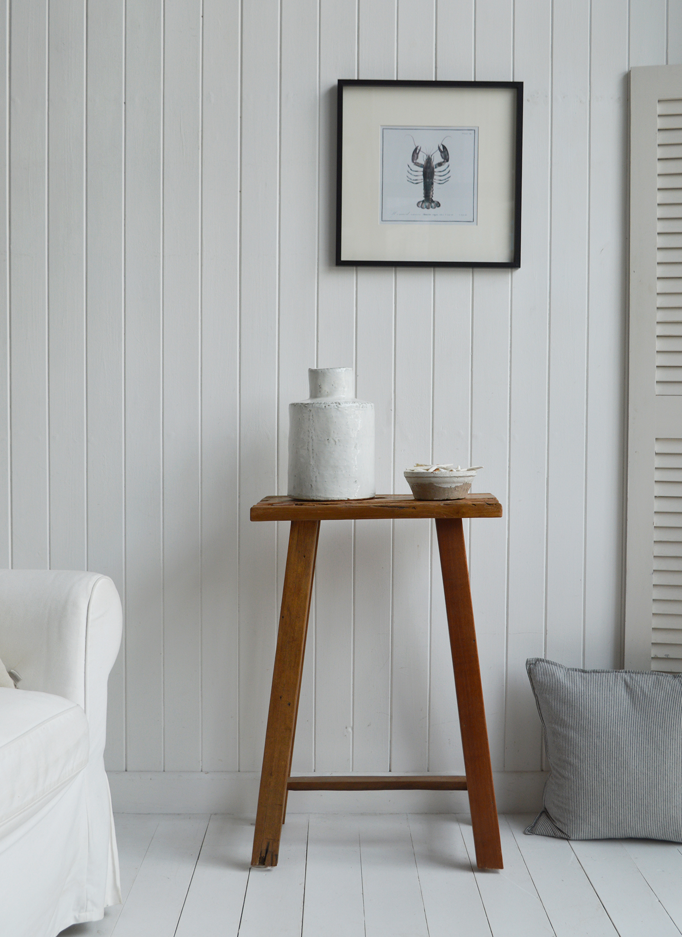 Peabody rustic teak wooden stool as a lamp or side table in a coastally inspired home