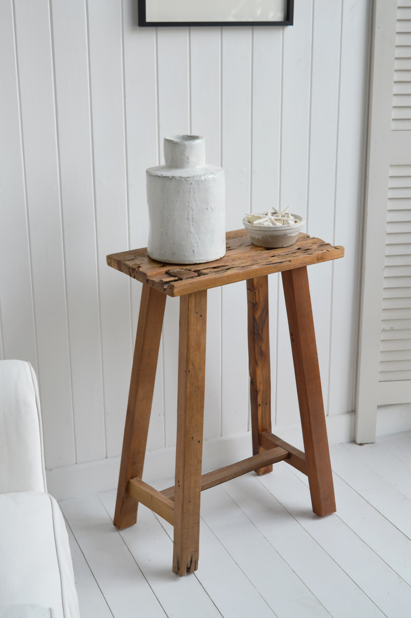 Peabody rustic teak wooden stool as a lamp or side table in a coastal inspired home