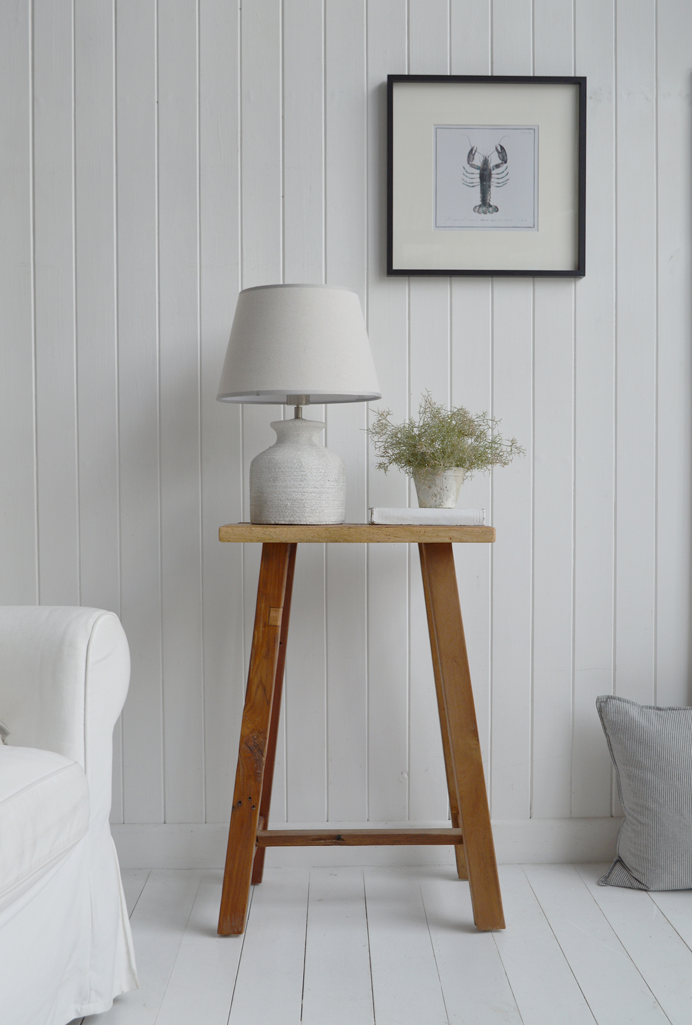 Peabody rustic teak wooden stool as a lamp or side table in a coastally Hamptons inspired home