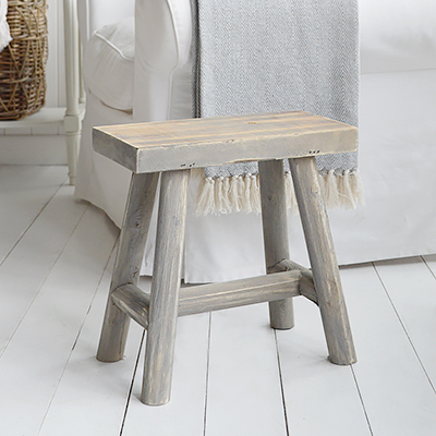 Bring coastal charm home with the Pettegrove Stool — rustic, weathered wood with driftwood-grey finish, perfect for farmhouse or seaside interiors.