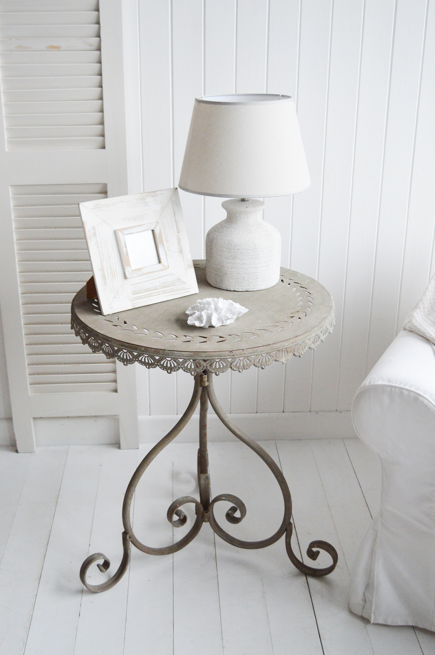 This elegant side table perfectly complements a coastal-inspired interior with its light, airy design and natural textures. Whether placed beside a sofa or bed, it adds a touch of relaxed seaside charm to any space.