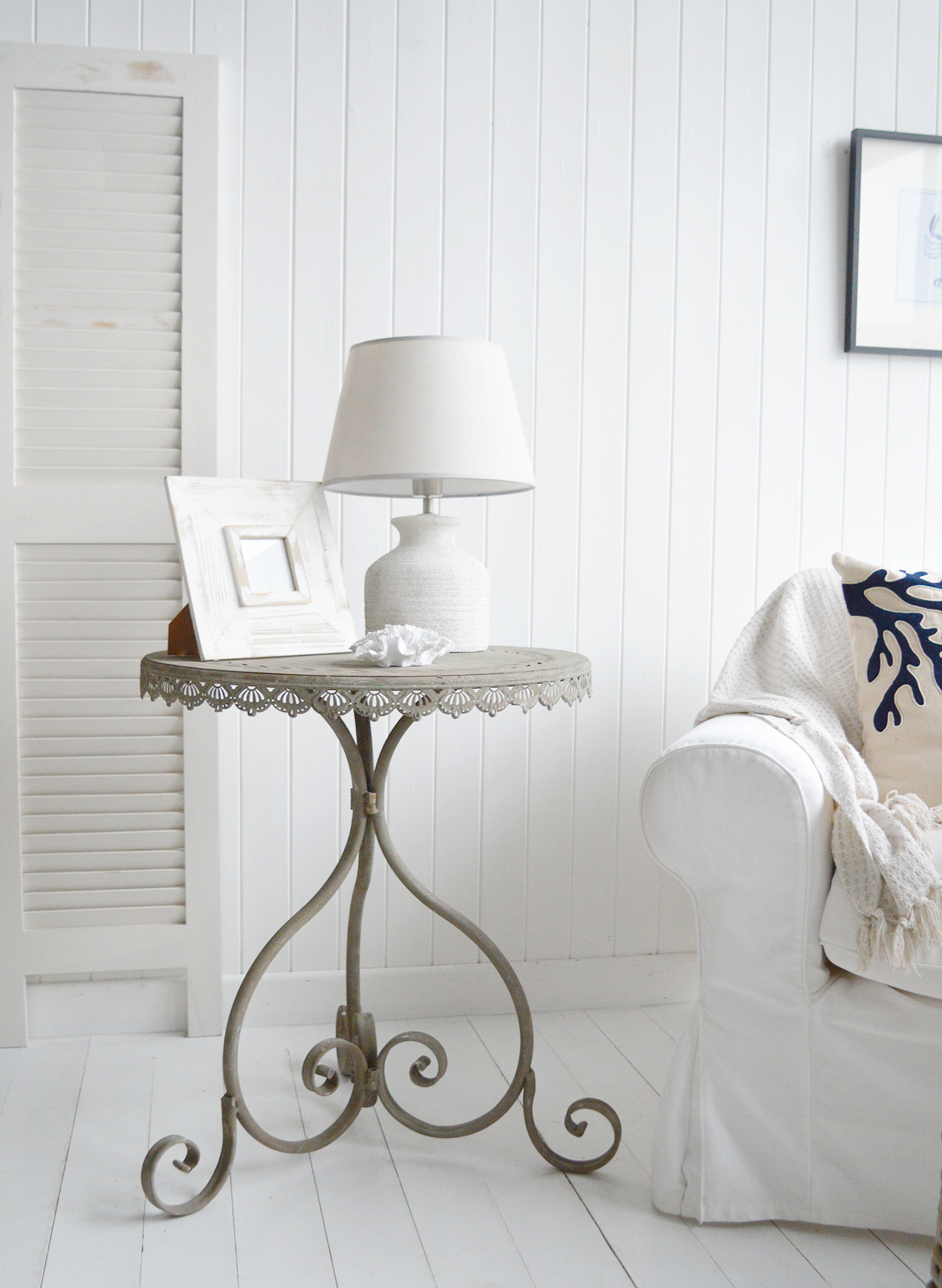 This elegant side table perfectly complements a coastal-inspired interior with its light, airy design and natural textures. Whether placed beside a sofa or bed, it adds a touch of relaxed seaside charm to any space.