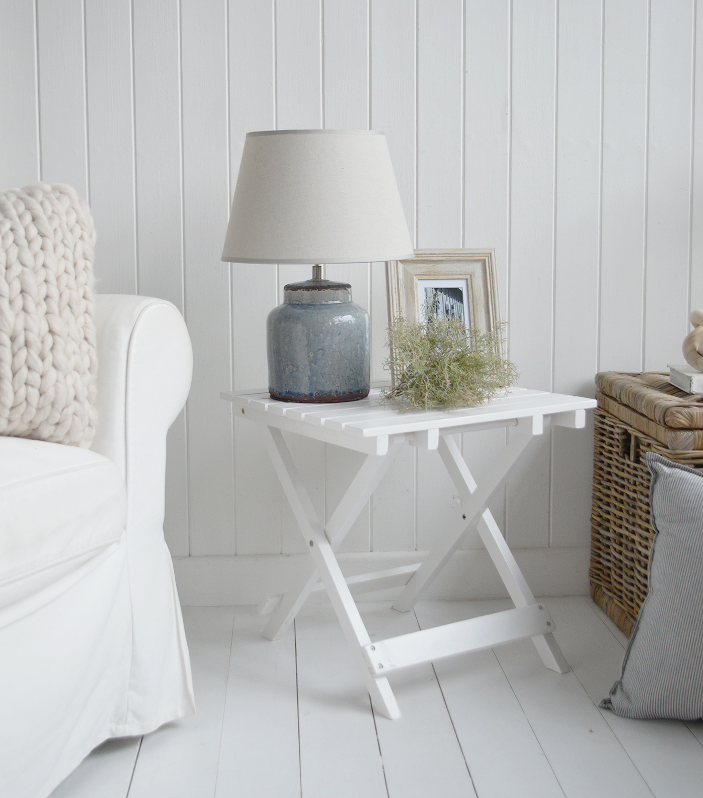 Use calming coastal colours along with the white furniture pieces when decorating a coastal Hamptons home interior.