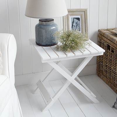 The Portland folding white table is a small wooden side table or lamp bedside table s from The White Lighthouse Furniture. Bathroom, Living Room, Bedroom and Hallway Furniture for beautiful homes. Coastal, Modern Farmhouse and Country Furniture for beautiful home interiors