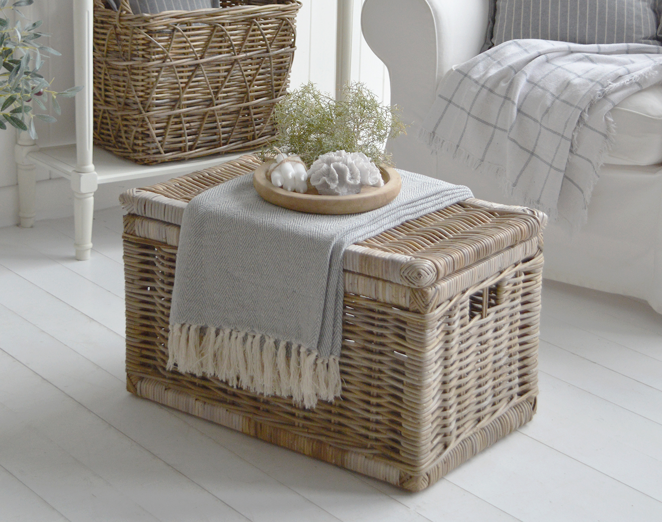 Small Seaside Willow basket coffee table in a white Hamtons or New England coastal living room