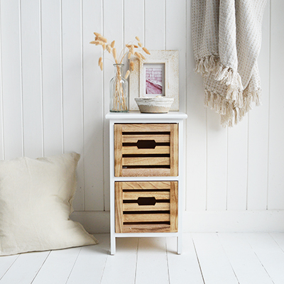 The Northport narrow bedside table combines a crisp white frame with natural wood drawers for a breezy coastal look. Perfect as a slim bedside table for small bedrooms or guest rooms.